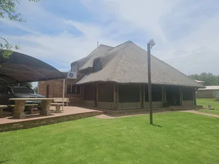 Double storey four bedroom thatch house on the banks of the Vaalriver