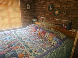 Double storey four bedroom thatch house on the banks of the Vaalriver