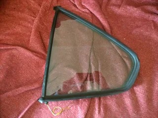 BMW E36 passenger rear small window.