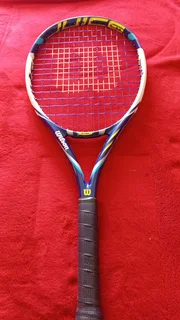 Wilson Juice 26 graphite tennis racket. Excellent condition and comes with bag.