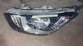 Hyundai i20 left front headlight for sale.