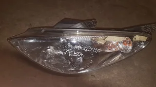 Hyundai I20 left front headlight for sale.
