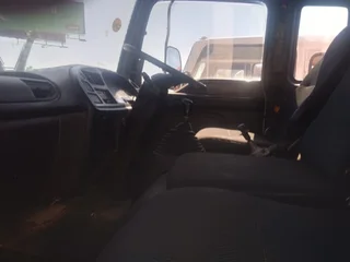 2011 Isuzu FTR700 Garbage box truck with tail lift.