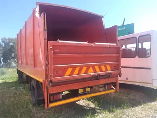 2011 Isuzu FTR700 Garbage box truck with tail lift.