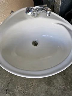 Bathroom basin with mixer