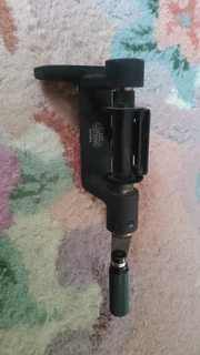 Camera bean bag, vintage lens and 35mm film reel