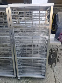 TWO ALIMUNIUM TROLLEYS WITH BASKETS