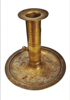 Brass candle with self extinguishing device
