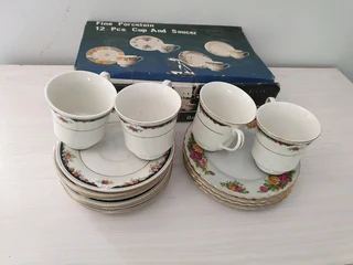 Fine Porcelain 12 Pcs Cup And Saucer Set With Extras