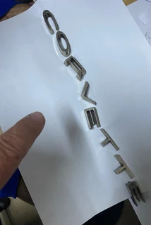 Corvette letters badge emblem.