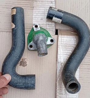 Mini radiator hoses x2 & thermostat.