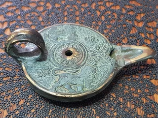 Bronze Oil Lamp showing the Griffin.