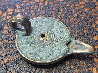 Bronze Oil Lamp showing the Griffin.