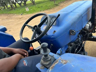 New Holland 6610 Tractor with Spartan Crane