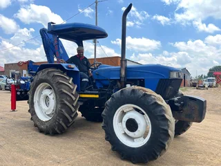 New Holland 6610 Tractor with Spartan Crane