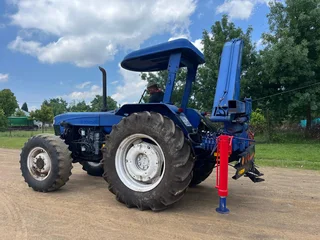 New Holland 6610 Tractor with Spartan Crane