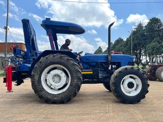 New Holland 6610 Tractor with Spartan Crane