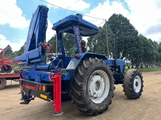 New Holland 6610 Tractor with Spartan Crane