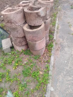 Retaining blocks and precast slabs