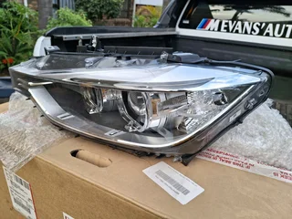 Bmw 2015 left front zenon headlamp brand new original