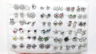 36 pairs of chrome costume earrings