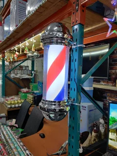 Rotating barber sign pole