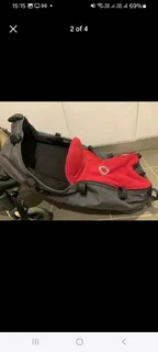 Bassinet and rain cover for the Bugaboo Chameleon pram all as new never used.