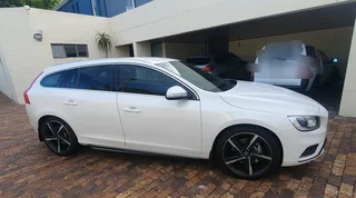 2014 White Volvo V60 D5 R design 2.4 D 5-cylinder twin-scroll turbo diesel station wagon automatic