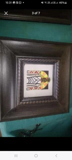Framed Art By Cheryl Churnick Buddha Tribal  in a dark hardwood frame.Both in excellent condition