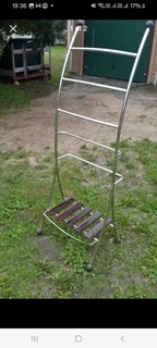 Large chrome plated towel rail free standing with chrome rails and wooden shelf at bottom VGC