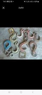 selection of various sized rigging hooks selling as job lot.