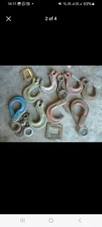 selection of various sized rigging hooks selling as job lot.
