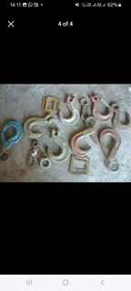 selection of various sized rigging hooks selling as job lot.