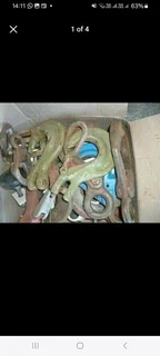 selection of various sized rigging hooks selling as job lot.