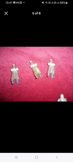 Vintage metal pirate figurines and associated maritime pieces such as treasure chests canons etc