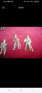 Vintage metal pirate figurines and associated maritime pieces such as treasure chests canons etc