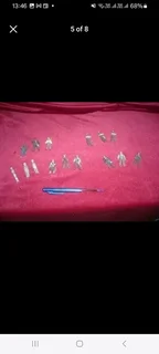 Vintage metal pirate figurines and associated maritime pieces such as treasure chests canons etc