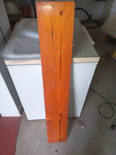 Varnished wooden shelf with wooden supports