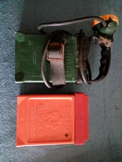 Gold Miner head lamp and battery pack plus spare battery.  80s era.