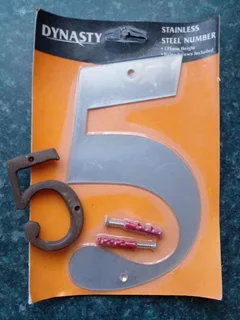 One Number 5 stainless house number and small brass number 5 left.
