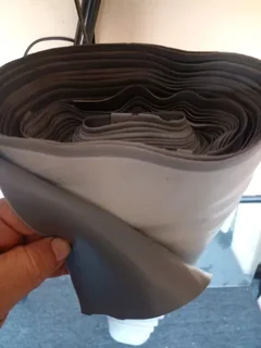 Grey rubber auto material or cover table top or where you might needs some.