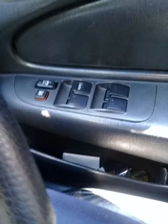 Corolla rxi window drivers side switch cover/housing