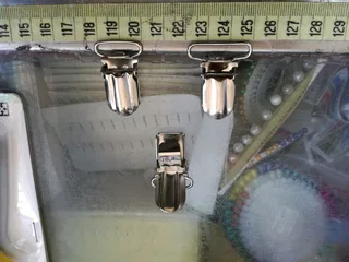 Brace clips. Suspender clips.