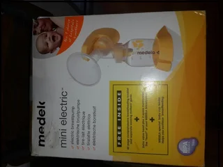 Medela Mini Electric breast feeding pump complete and still in box( but opened) unused present
