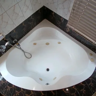 Corner spa bath Jacuzzi from Bathroom Bizarre