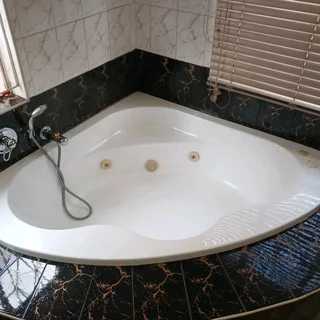 Corner spa bath Jacuzzi from Bathroom Bizarre