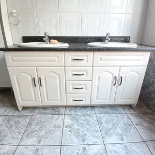 Bathroom double vanity with granite, basins, mixer taps