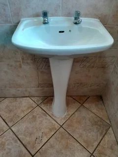 White ceramic basin and pedestal set