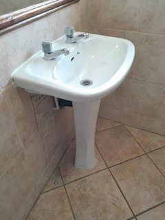 White ceramic basin and pedestal set