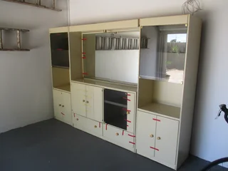 2Wall unit with built in bar, lots of storage space, sliding drawers and mirrors. Great value .